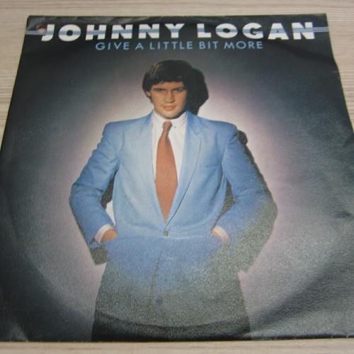 Single / Johnny Logan ?– Give A Little Bit More   / NL PRESS / RAR /